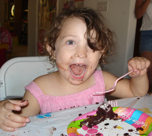 Natalia enjoying some cake.